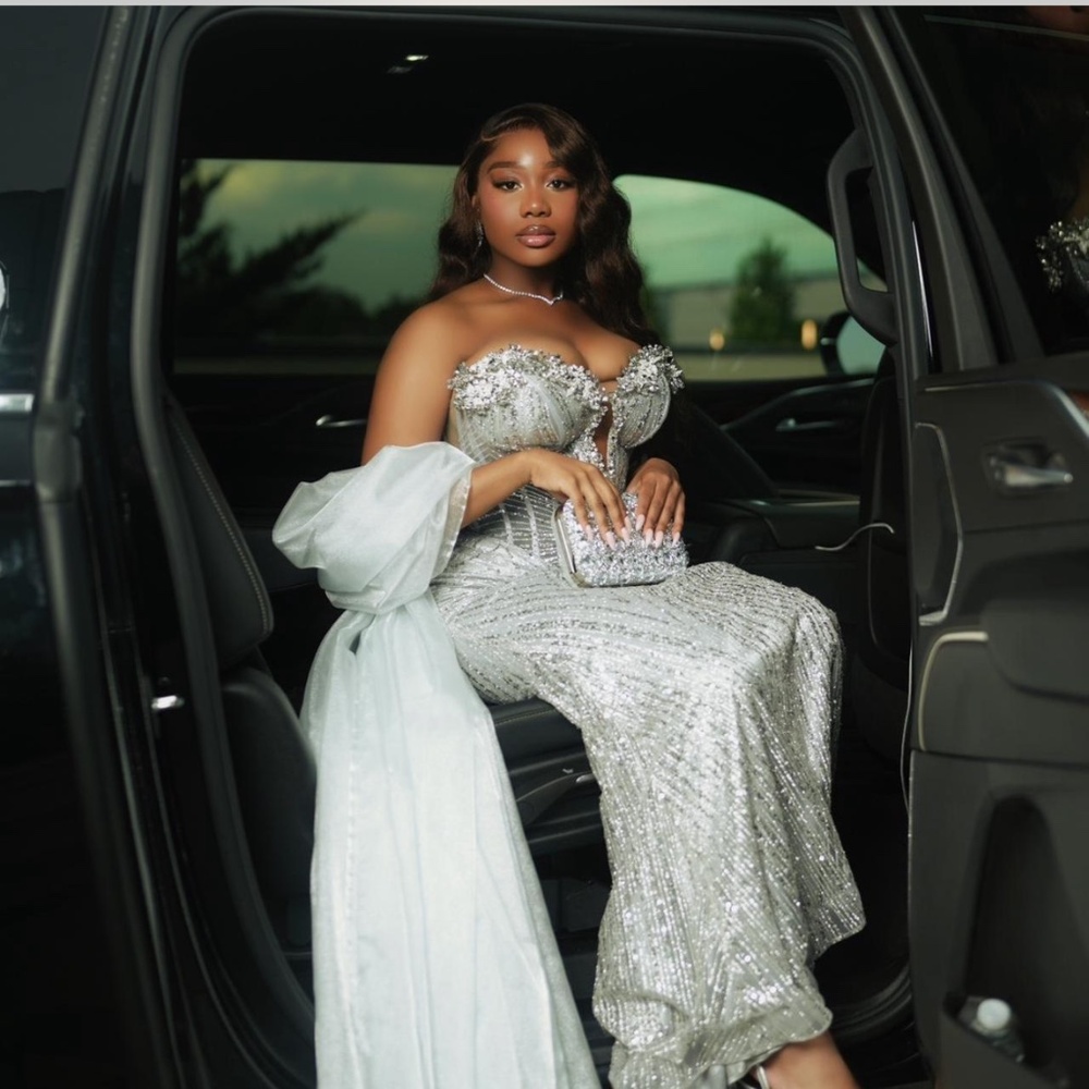 Silver gown/prom dress with shawl included. Adjustable.